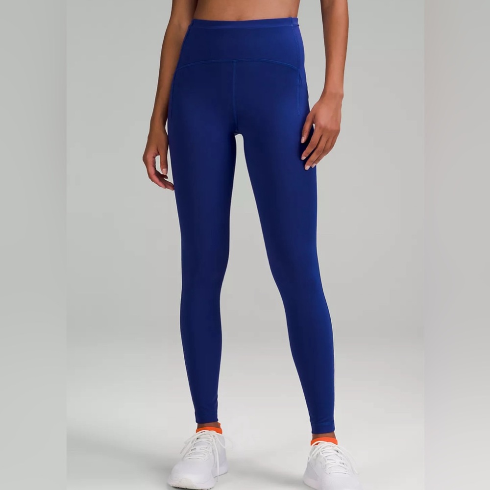 Lululemon blue high rise running leggings with side pockets. Super comfortable.